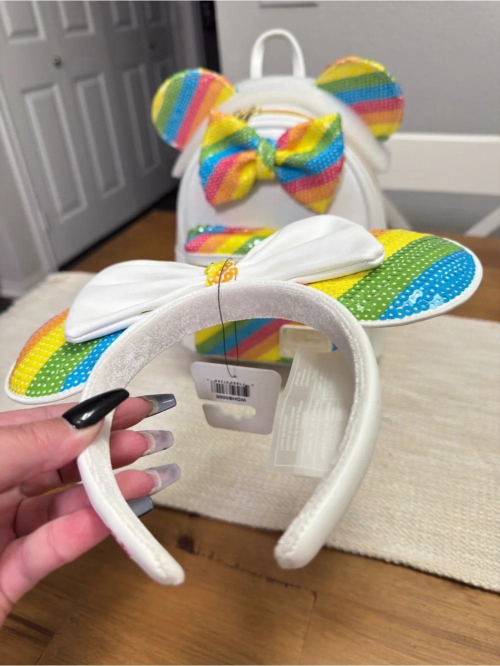Loungefly White Mini Backpack with Rainbow Sequin Ears and Bow